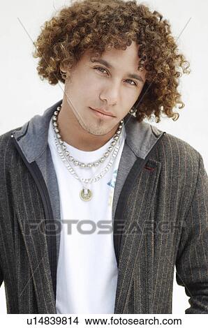 Picture - Young Man in studio, portrait, half length. Fotosearch