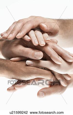 Young men and women stacking hands, close up of hands View Large Photo Image Stock Image - Young men and women stacking hands, close up of hands. Fotosearch