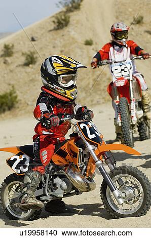 Young motocross racer in desert View Large Photo Image Stock Image - Young motocross racer in desert. Fotosearch