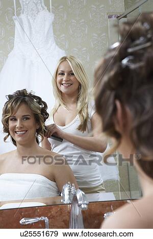 Young woman dressing bride's hair, reflection View Large Photo Image Stock Photo - Young woman dressing bride's hair, reflection. Fotosearch