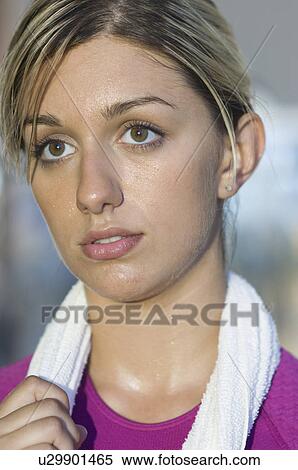 Young Woman Holding Towel After Exercising View Large Photo Image Stock Photography - Young Woman Holding Towel After Exercising. Fotosearch