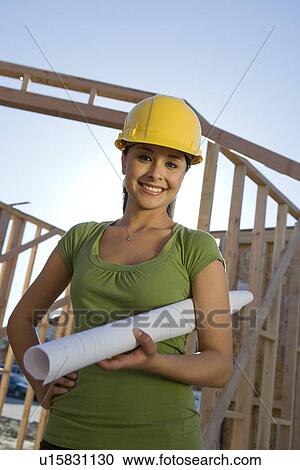 Young woman in construction site View Large Photo Image Stock Image - Young woman in construction site. Fotosearch