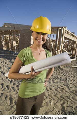 Young woman in construction site View Large Photo Image Stock Image - Young woman in construction site. Fotosearch