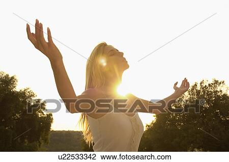 Young woman practising yoga, portrait View Large Photo Image Stock Image - Young woman practising yoga, portrait. Fotosearch