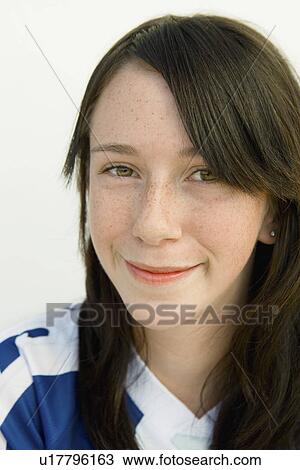 Stock Image - Young woman with black hair, (close-up), (portrait). Fotosearch
