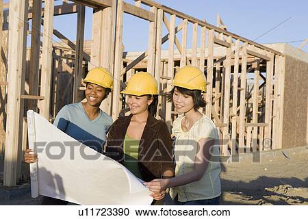 Young women in construction site View Large Photo Image Stock Image - Young women in construction site. Fotosearch