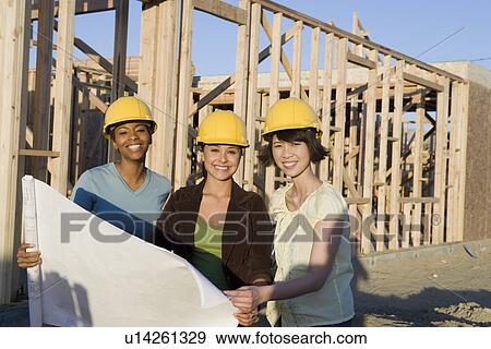 Young women in construction site View Large Photo Image Stock Photo - Young women in construction site. Fotosearch