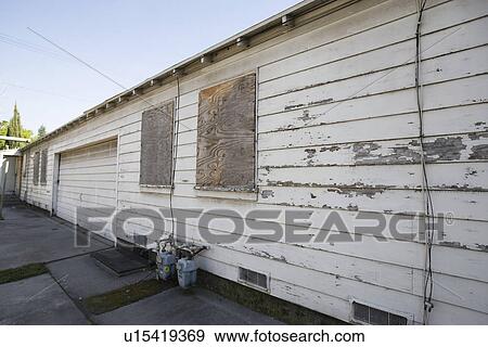 Abandoned Building With Boarded Windows and Peeling Paint View Large Photo Image Stock Photo - Abandoned Building With Boarded Windows and Peeling Paint. Fotosearch