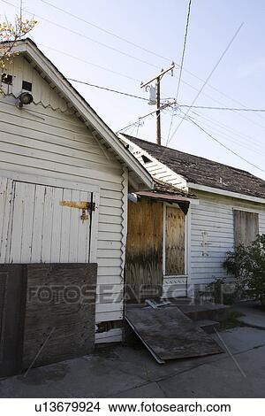 Picture - Abandoned House With Boarded Up Door. Fotosearch