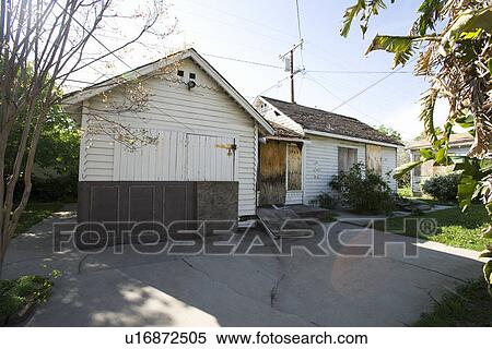 Stock Photography - Abandoned House With Boarded Up Door. Fotosearch