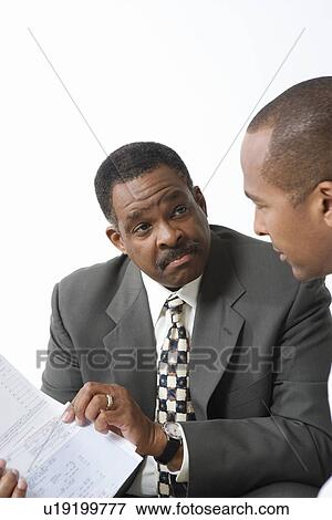 Stock Photo - Accountant and Client Going over Bills. Fotosearch