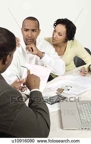 Stock Image - Accountant Giving Bad News. Fotosearch