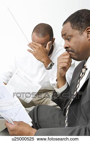 Stock Photography - Accountant Giving Client Bad News. Fotosearch