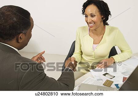 Stock Image - Accountant Shaking Client's Hand. Fotosearch