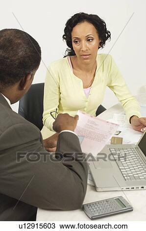 Stock Image - Accountant Talking with Client. Fotosearch