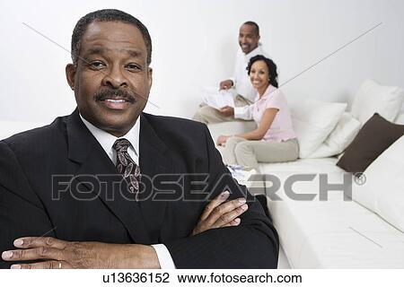 Stock Image - Accountant with Client Couple. Fotosearch