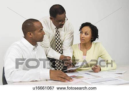 Stock Photo - Accountant Working with Couple. Fotosearch