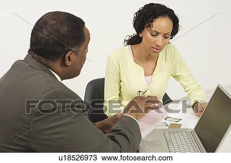 Stock Image - Accountant Working with Woman. Fotosearch