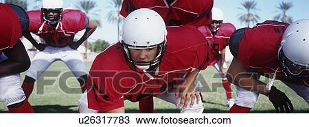 Stock Image - American football players during game. Fotosearch