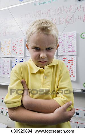 Angry Little Boy in a Classroom View Large Photo Image Picture - Angry Little Boy in a Classroom. Fotosearch