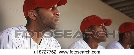 Baseball players sitting in dugout View Large Photo Image Stock Image - Baseball players sitting in dugout. Fotosearch