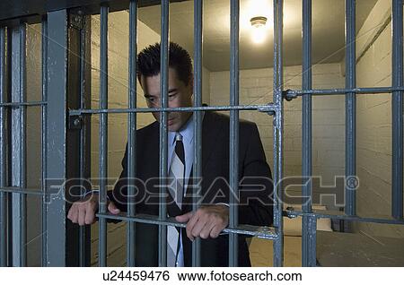 Stock Photograph - Behind the bars. Fotosearch