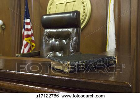 Stock Photograph - Bible beside judges chair in court. Fotosearch