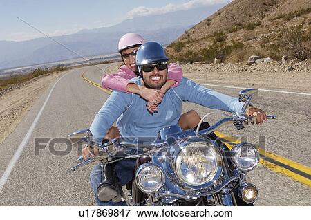 Bikers riding on desert road View Large Photo Image Stock Photo - Bikers riding on desert road. Fotosearch