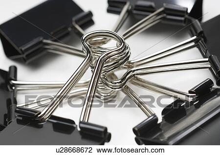 Stock Image - Binder clips, close-up. Fotosearch