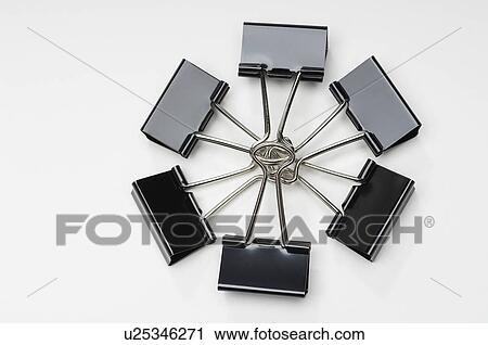 Stock Image - Binder clips on white background. Fotosearch