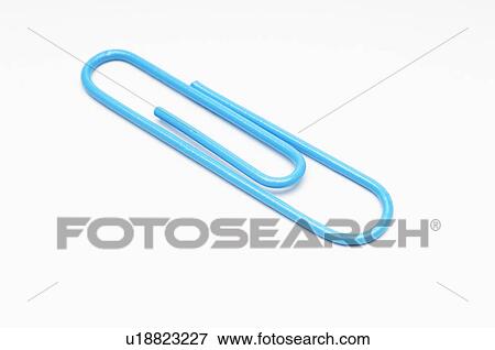 Blue paper clip on white background View Large Photo Image Stock Photo - Blue paper clip on white background. Fotosearch