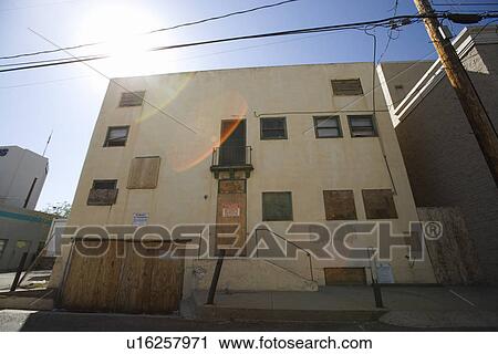 Stock Image - Boarded Up Apartment Building. Fotosearch