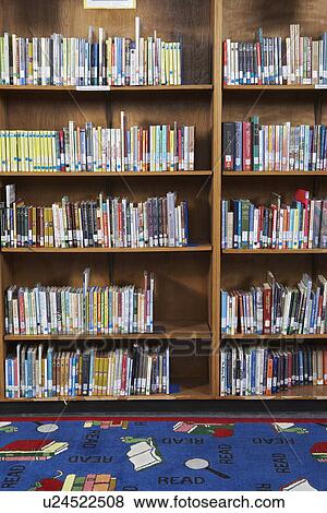 Stock Photo - Bookshelf in library. Fotosearch