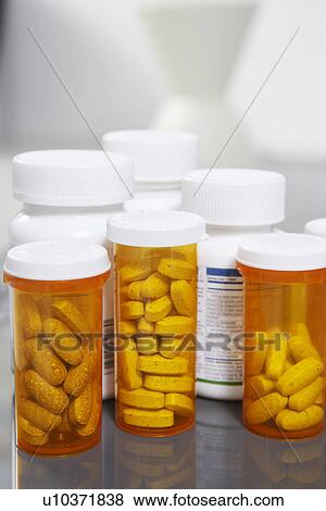 Stock Photo - Bottles of pills, close-up. Fotosearch