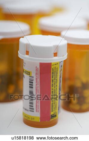 Bottles of pills, close-up View Large Photo Image Stock Photo - Bottles of pills, close-up. Fotosearch