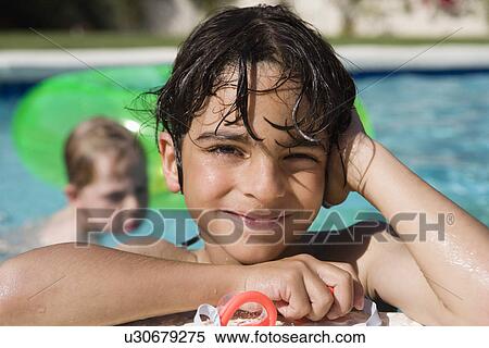 Stock Photography - Boy at Edge of Swimming Pool. Fotosearch