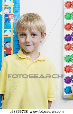Stock Photo - Boy Getting Height Measured. Fotosearch