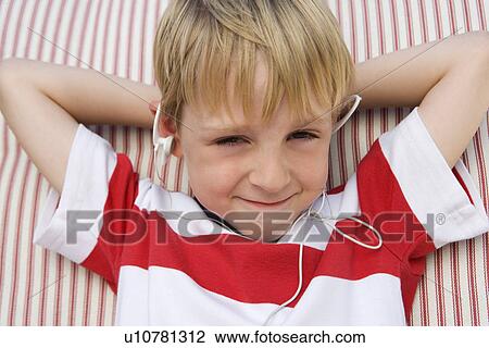Boy Listening to Headphones View Large Photo Image Stock Image - Boy Listening to Headphones. Fotosearch