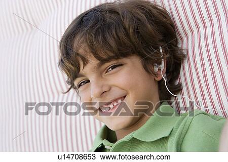 Boy Listening to Headphones View Large Photo Image Stock Image - Boy Listening to Headphones. Fotosearch