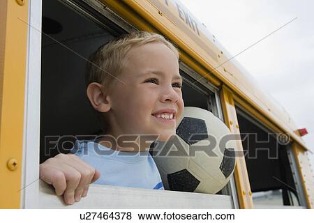 Stock Photo - Boy on School Bus. Fotosearch