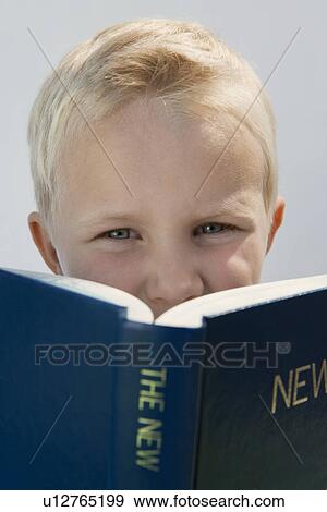 Stock Photo - Boy Reading The New Testament. Fotosearch