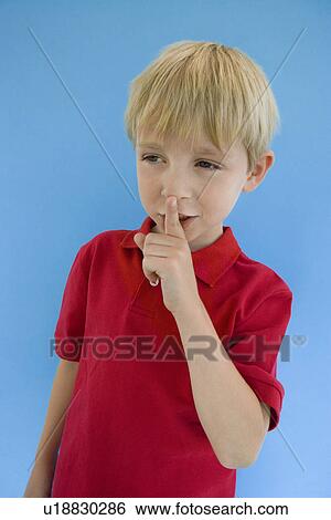 Stock Photograph - Boy with Finger on Lips. Fotosearch