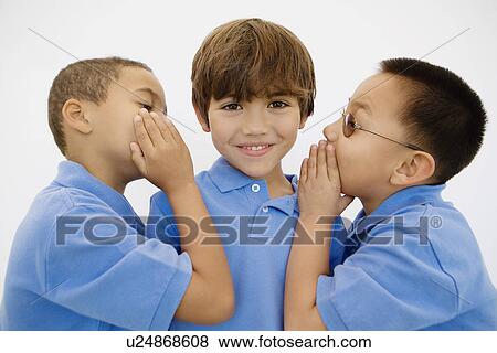 Stock Photo - Boys Whispering. Fotosearch