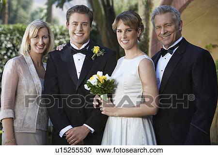 Stock Image - Bride, groom, and parents, portrait. Fotosearch
