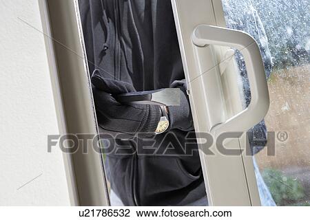 Burglar breaking into house, mid section View Large Photo Image Stock Image - Burglar breaking into house, mid section. Fotosearch