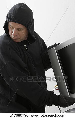Burglar stealing television set View Large Photo Image Stock Photograph - Burglar stealing television set. Fotosearch