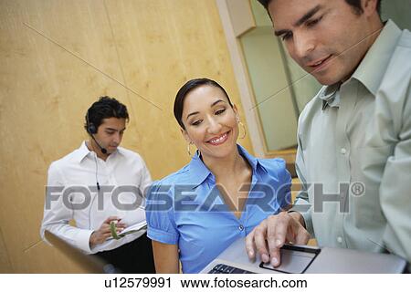Business colleagues working in office View Large Photo Image Stock Image - Business colleagues working in office. Fotosearch
