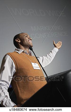 Picture - Business man giving presentation at conference meeting. Fotosearch