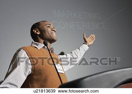 Business man presenting conference meeting View Large Photo Image Stock Photo - Business man presenting conference meeting. Fotosearch