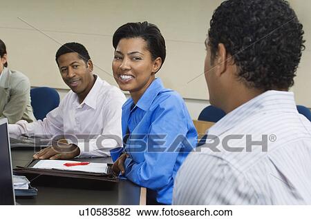 Business people sitting in classroom View Large Photo Image Stock Image - Business people sitting in classroom. Fotosearch